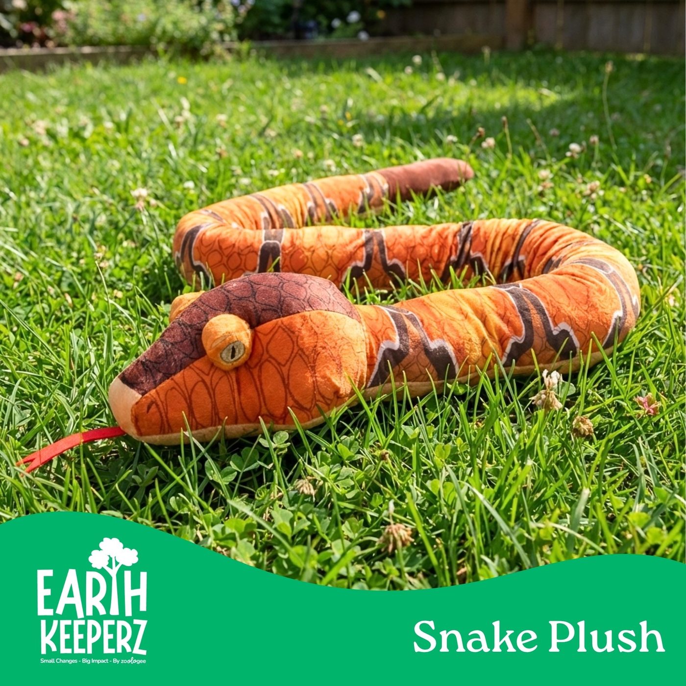 Two long Earth Keeperz snake plush toys coiled in the grass